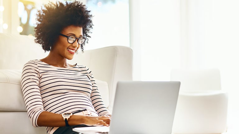 Woman on computer requesting delivery change