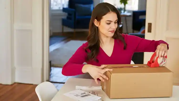 Woman repacking a box