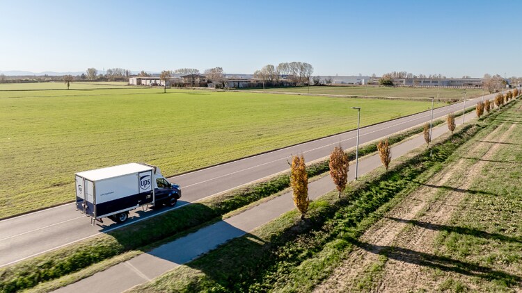 image of ups truck driving on the road